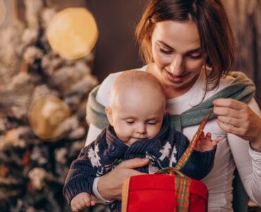 Mother with her baby boy celebrating christmas