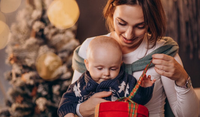 Mother with her baby boy celebrating christmas